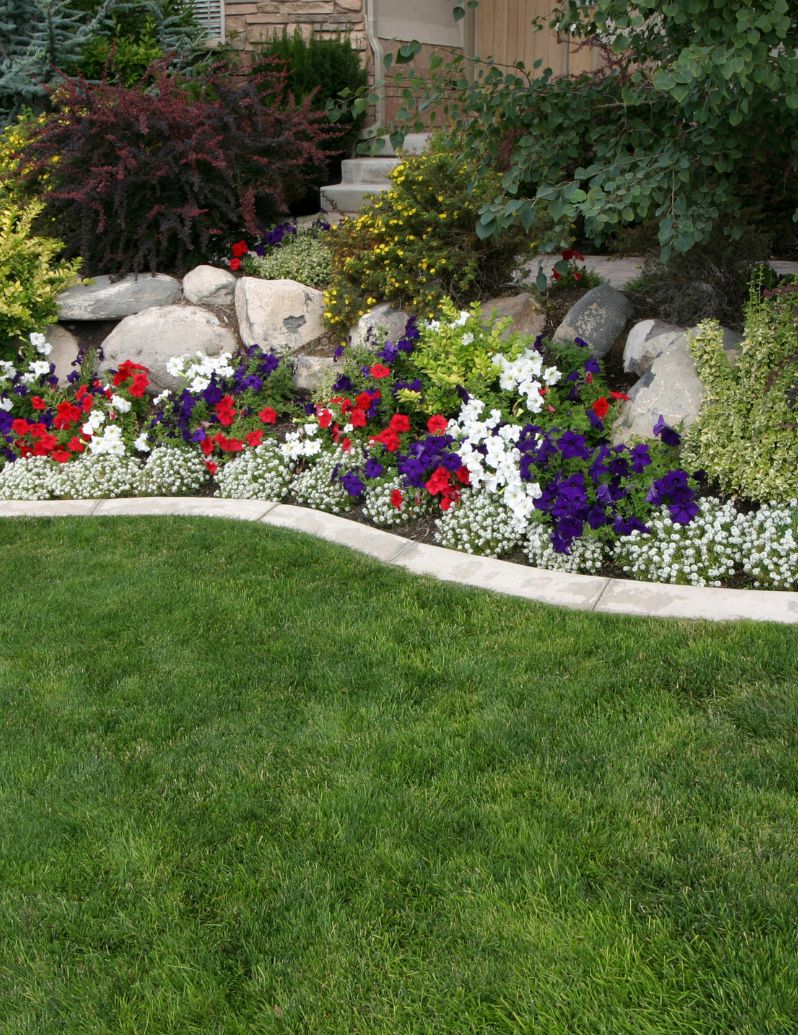 Beautiful landscape with colorful flowers and pristine lawn